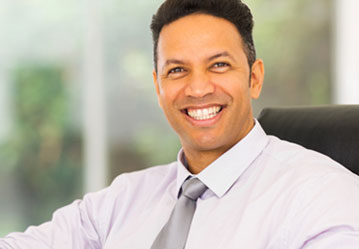 Man smiling in office