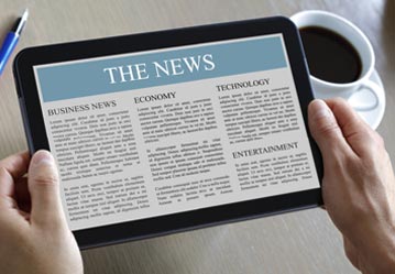 Closed-up of tablet displaying news